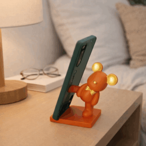 Βάση κινητού-tablet αρκουδάκι πορτοκαλί με χρυσά αυτιά και χρυσό παπιγιόν