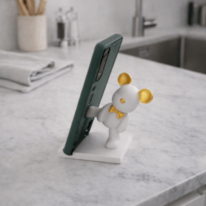 Βάση κινητού-tablet αρκουδάκι λευκό με χρυσά αυτιά και χρυσό παπιγιόνΒάση κινητού-tablet αρκουδάκι λευκό με χρυσά αυτιά και χρυσό παπιγιόν